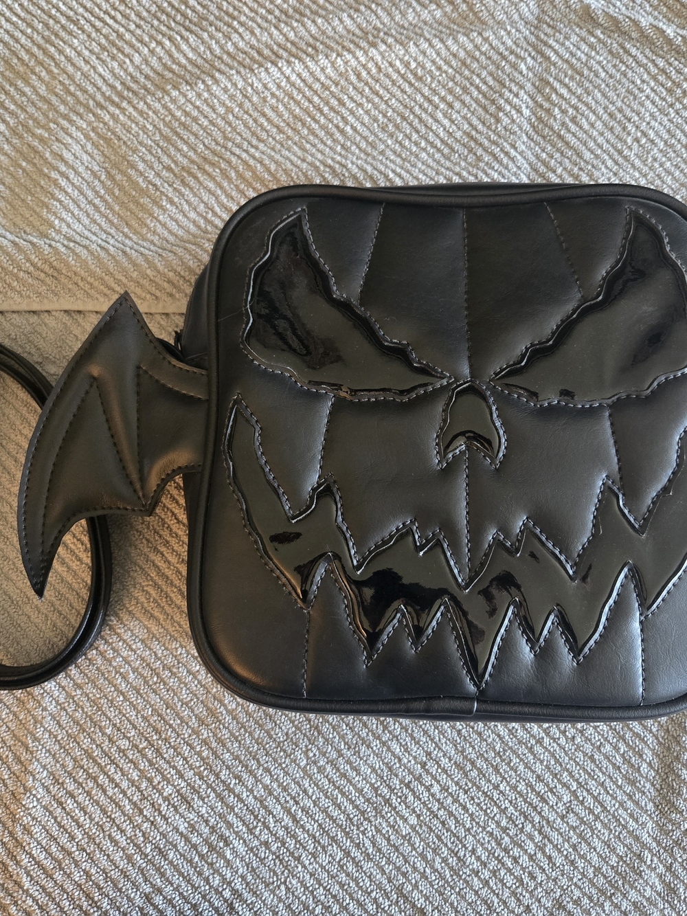 Black Men’s Crossbody Bag with Bat Wing Accent